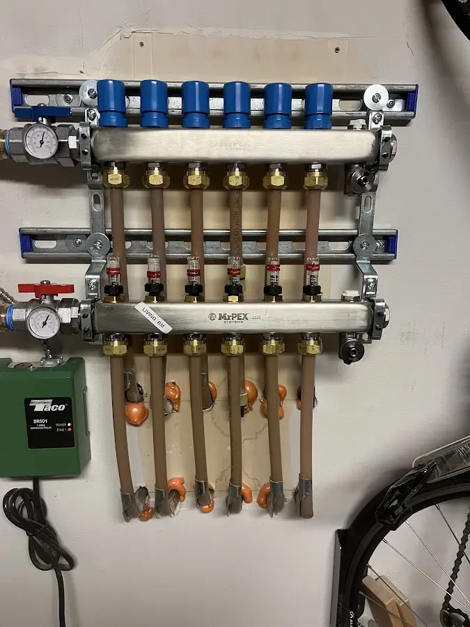 Plumber performing Water Heater Repair at a residential property in Dexter